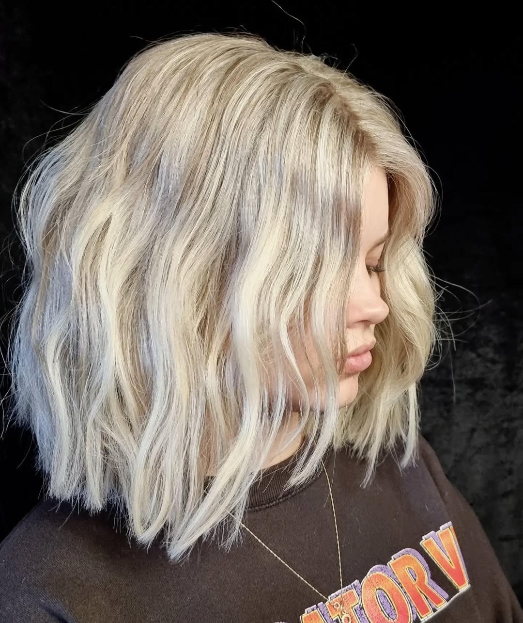 Platinum blonde textured wavy bob haircut at Studio 15 hair salon Northland