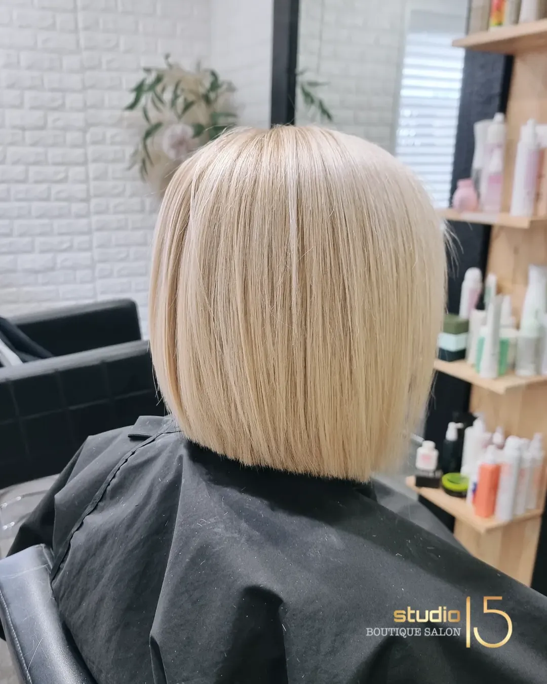 Platinum blonde sleek precision bob at Studio 15 boutique salon Waipapa