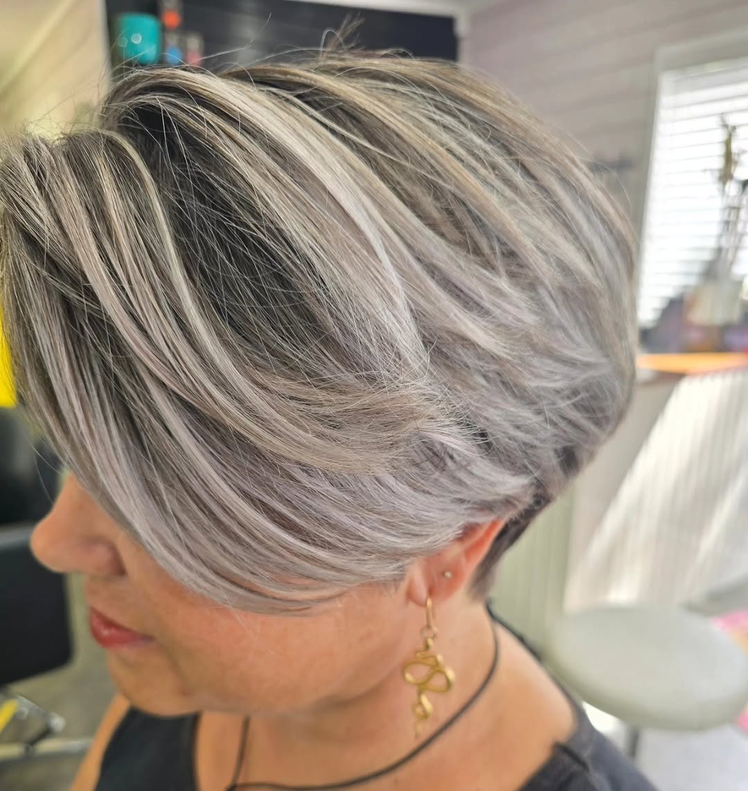 Silver grey pixie cut with dimensional highlights at Studio 15 Northland
